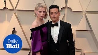 Love Doves! Rami Malek and Lucy Boynton embrace at 2019 Oscars
