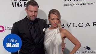 Natalie Zea and Travis Schuldt arrive at Elton John Oscar bash - Daily Mail